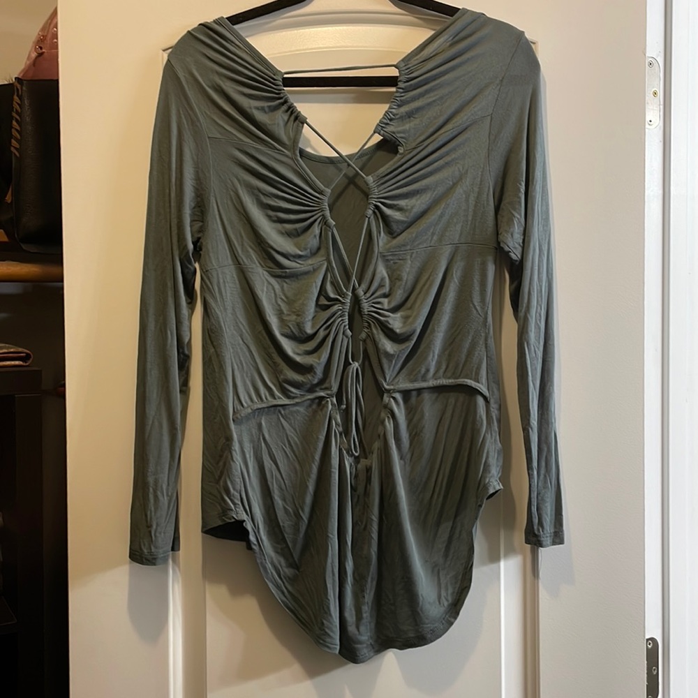 Long sleeved open back shirt.